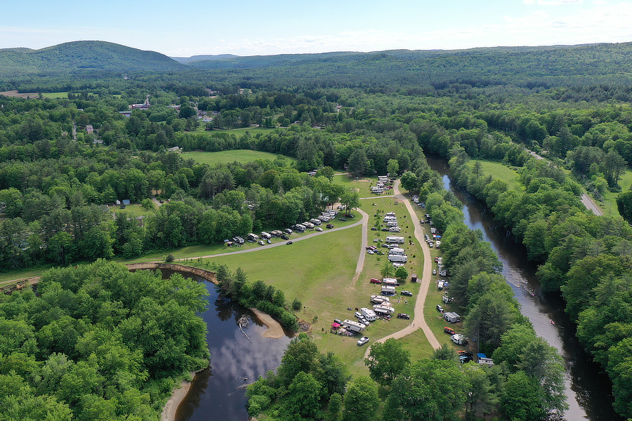 Aerial view of campground with mountains in background