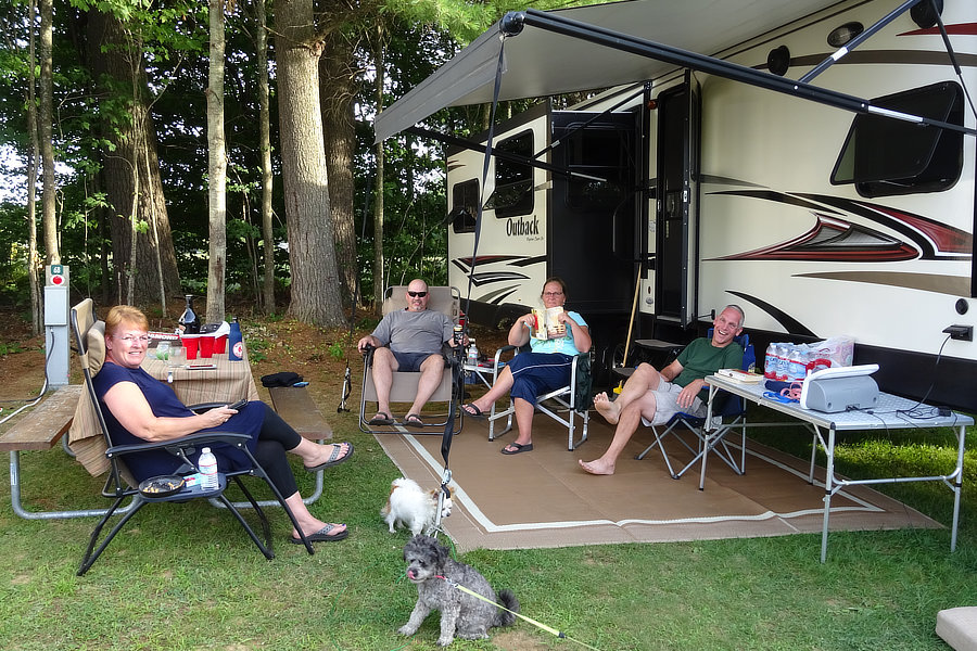 Family relaxing at RV site